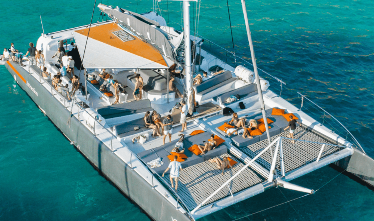 Large group enjoying a private boat hire on the water in Mallorca with Vibe Mallorca