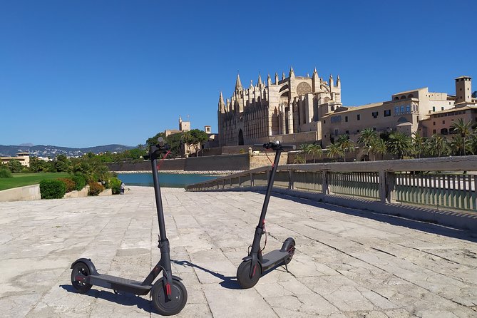 electric scooters posing infant of the palma cathedral.